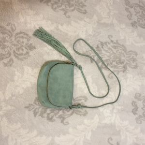 Non leather material bag. Turquoise or teal color.